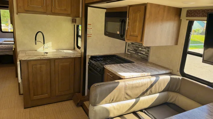 Sofa with footrests alongside the galley